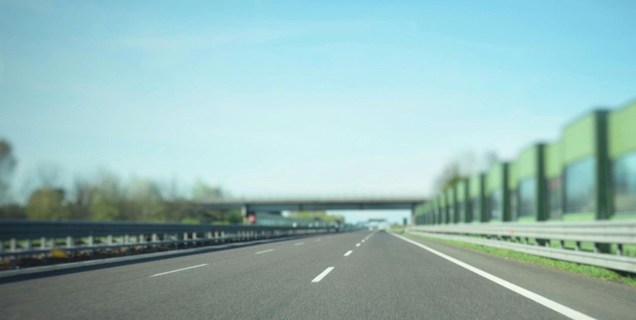 Photo by photoGraph: https://www.pexels.com/photo/gray-asphalt-road-under-blue-sky-1021683/